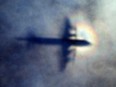 In this March 31, 2014 file photo, the shadow of a Royal New Zealand Air Force P3 Orion is seen on low level cloud while the aircraft searches for missing Malaysia Airlines Flight MH370 in the southern Indian Ocean, near the coast of Western Australia.