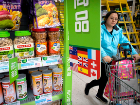 A woman pushes a shopping cart past a display of nuts imported from the United States at a supermarket in Beijing. China raised import duties on a slew of U.S. products on April 2, 2018 in an escalating tariff dispute with President Donald Trump.