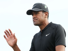Tony Finau waves on the 18th green during the first round of the Masters on April 5.
