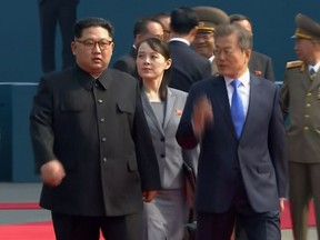 In this image made from video provided by Korea Broadcasting System (KBS), North Korean leader Kim Jong Un, left, walks with South Korean President Moon Jae-in and his sister Kim Yo Jong at the border village of Panmunjom in the Demilitarized Zone Friday, April 27, 2018. Their discussions will be expected to focus on whether the North can be persuaded to give up its nuclear bombs.(Korea Broadcasting System via AP)