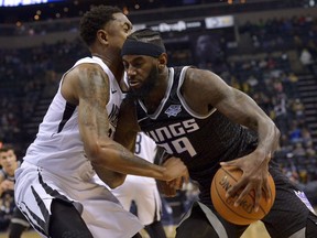 Sacramento Kings forward JaKarr Sampson (29) drives against Memphis Grizzlies guard MarShon Brooks during the first half of an NBA basketball game Friday, April 6, 2018, in Memphis, Tenn.