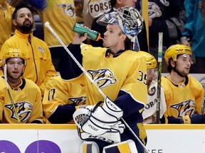 In this Feb. 25, 2018, photo, Nashville Predators goalie Pekka Rinne (35), of Finland, takes a break in the third period of an NHL hockey game against the St. Louis Blues in Nashville, Tenn. Rinne was a key factor in falling short in the Stanley Cup Final last season when he got chased twice in Pittsburgh. He's bounced back with a Vezina-worthy season with some unfinished business. The Predators are scheduled to face the Colorado Avalanche in the first round of the NHL Stanley Cup playoffs Thursday