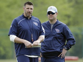 Tennessee Titans head coach Mike Vrabel, left, talks with general manager Jon Robinson during a voluntary practice at its NFL football training facility Wednesday, April 25, 2018, in Nashville, Tenn.