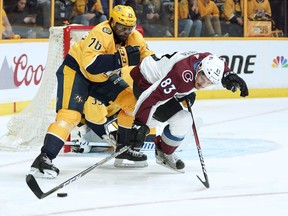 Nashville Predators defenseman P.K. Subban (76) knocks Colorado Avalanche left wing Matt Nieto (83) off the puck during the first period in Game 5 of an NHL hockey first-round playoff series Friday, April 20, 2018, in Nashville, Tenn.