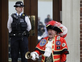 "Official" Town Crier Tony Appleton announces that the Duchess of Cambridge has given birth to a baby boy outside the Lindo Wing at St. Mary's Hospital.