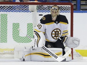 Boston Bruins goaltender Tuukka Rask (40) makes a save on a shot by the Tampa Bay Lightning during the first period of Game 1 of an NHL second-round hockey playoff series Saturday, April 28, 2018, in Tampa, Fla.