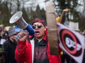 Protesters opposed to the Kinder Morgan Trans Mountain pipeline expansion defy a court order and block an entrance to the company's property in Burnaby, B.C., on April 7, 2018.
