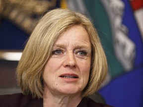 Alberta Premier Rachel Notley talks to cabinet members about the Kinder Morgan pipeline expansion in Edmonton on April 9, 2018.