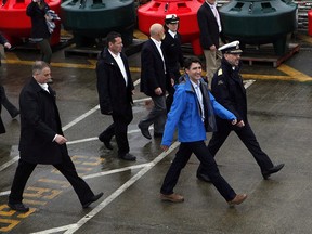 Prime Minister Justin Trudeau arrives to meet with Canadian Coast Guard members aboard the Sir Wilfrid Laurier to discuss marine safety and spill prevention, in Victoria on Thursday, April 5, 2018.