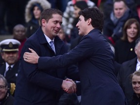 Prime Minister Justin Trudeau (right) greets Federal Conservative Leader Andrew Scheer at a vigil remembering the victims of Monday's deadly van attack, at Mel Lastman Square in Toronto.