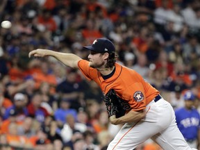 Houston Astros starting pitcher Gerrit Cole throws against the Texas Rangers during the third inning of a baseball game Friday, April 13, 2018, in Houston.