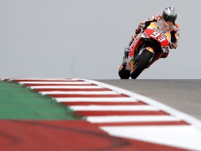 Marc Marquez (93) of Spain navigates through a turn during a warm up session for the Grand Prix of the Americas MotoGP motorcycle race at the Circuit Of The Americas in Austin, Texas, Friday, April, 20, 2018.