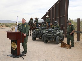 Aaron Hull, chief patrol agent of the U. S. Customs and Border Protection's El Paso Sector, speaks where construction on a new segment of the border wall will be built, near Santa Teresa, N.M., Monday, April 9, 2018. Hull says the troops could help with air support, surveillance and repairs of infrastructure along the border so that Border Patrol agents have more time to enforce immigration law.