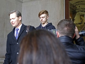 Ethan Couch, right, is released from Tarrant County Corrections Department in Fort Worth, Texas as his attorney is interviewed Monday, April 2, 2018. Couch, who as a 16-year-old driver drunkenly struck and killed four pedestrians but dodged prison after suggesting at trial that his irresponsibility was a result of his entitled upbringing, walked free Monday after serving almost two years in a Texas jail on a parole violation.