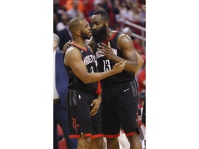 Houston Rockets guard Chris Paul (3) is calmed down by James Harden (13) after being separated from Minnesota Timberwolves guard Jamal Crawford during the second half of Game 5 of an NBA basketball first-round playoff series Wednesday, April 25, 2018, in Houston.