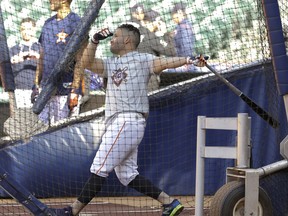 Houston Astros' Jose Altuve takes batting practice before a baseball game against the Texas Rangers, Sunday, April 15, 2018, in Houston. Both teams wore No. 42 in honor of Jackie Robinson Day.