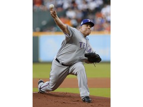 Texas Rangers' starting pitcher Bartolo Colon throws against the Houston Astros during the first inning of a baseball game Sunday, April 15, 2018, in Houston.