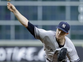 New York Yankees starting pitcher Sonny Gray throws against the Houston Astros during the first inning of a baseball game Monday, April 30, 2018, in Houston.