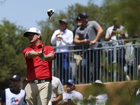 Zach Johnson tracks his tee shot off No. 1 during the first round of the Valero Texas Open golf tournament at TPC San Antonio on Thursday, April 19, 2018.