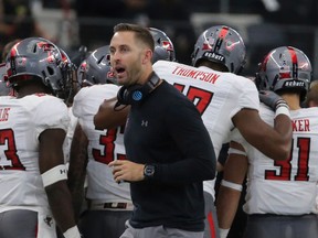 FILE - In this Nov. 11, 2017, file photo, Texas Tech Head Football coach Kliff Kingsbury on the sidelines against Baylor in the first half of an NCAA college football game, in Arlington, Texas. Kingsbury is still popular at Texas Tech, five years after his hiring as coach unified a fractured football program at his alma mater.