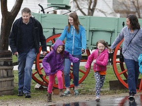 In this April 6, 2018, photo, Amy Coulter, right, and her husband Mark, second left, play with their children at the Place Heritage Park in Salt Lake City. After Utah passed the country's first law legalizing so-called free-range parenting, groups from New York to Texas are pushing for similar steps to bolster the idea that supporters say is an antidote for anxiety-plagued parents and overscheduled children. Amy Coulter, a stay-at-home Utah mother, said she doesn't call herself a free-range parent. But she does avoid intervening with teachers on her older children's grades and encourages her children to use their own money to buy things at the grocery store.