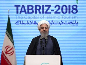 In this photo released by official website of the office of the Iranian Presidency, President Hassan Rouhani speaks during a conference in the northwestern city of Tabriz, Iran, Wednesday, April 25, 2018. (Iranian Presidency Office via AP)