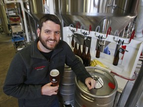 Pulitzer Prize winning photojournalist, Ryan Kelly, poses in the brewery at his new job at Ardent Craft Ales in Richmond, Va., Tuesday, April 17, 2018. Kelly left journalism shortly after shooting his prize winning photo to work in the social medial division of the brewery.