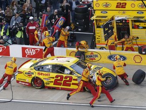 Joey Logano makes a pit stop during the NASCAR Cup Series auto race at Richmond Raceway in Richmond, Va., Saturday, April 21, 2018.