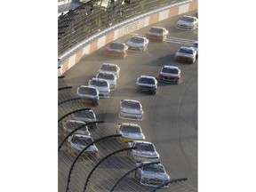 Cole Custer leads the field at the start of the NASCAR Xfinity Series auto race at Richmond Raceway in Richmond, Va., Friday, April 20, 2018.