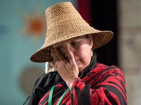 Bernie Williams, who has been an advocate for women in Vancouver's Downtown Eastside for 30 years, wipes away tears after testifying at the final day of hearings at the National Inquiry into Missing and Murdered Indigenous Women and Girls, in Richmond, B.C., on Sunday April 8, 2018. Williams said her abuse began at age three and continued through foster homes and a marriage, involving broken bones and brutal rapes. One foster family forced the kids to eat from bowls on their hands and knees, like dogs, she said.