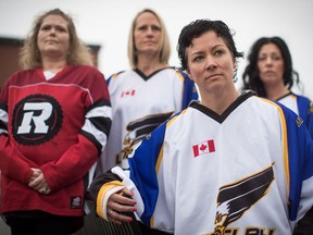 Jennifer Pinch, front right, who organized Jersey Day, which encourages people to wear a sports jersey, hockey or otherwise on Thursday in support of the Humboldt Broncos hockey team, poses for a photograph with friends Laura Westman, back left to right, Pamela Astles and Melynda Milligan, in Langley, B.C., on Wednesday April 11, 2018.