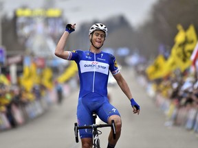 Netherland's Niki Terpstra from the Quick-Step team crosses the finish line to take first place in the Ronde van Vlaanderen in Oudenaarde, Belgium on Sunday, April 1, 2018.
