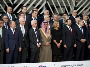 Front row, from left, Japan's Foreign Minister Taro Kono, Turkey's Deputy Prime Minister Recep Akdag, UN Special Envoy for Syria Staffan de Mistura, UN Under-Secretary General for Humanitarian Affairs and Emergency Relief Coordinator Mark Lowcock, Saudi Arabia's Foreign Minister Adel Ahmed al-Jubeir, European Union foreign policy chief Federica Mogherini, Lebanon's Prime Minister Saad Hariri and Jordan's Minister of Foreign Affairs Ayman Safadi pose during a group photo at a conference 'Supporting the future of Syria and the region' at the Europa building in Brussels on Wednesday, April 25, 2018.