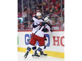 Columbus Blue Jackets left wing Matt Calvert (11) celebrates his goal with right wing Josh Anderson (77) during the first period in Game 5 of an NHL first-round hockey playoff series against the Washington Capitals, Saturday, April 21, 2018, in Washington.