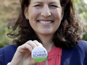 In this photo taken March 30, 2018, Dr. Kim Schrier, a candidate in Washington state's 8th District race, poses for a photo in Issaquah, Wash. Schrier, a pediatrician who's leading the Democratic field in fundraising, is among eight unknown Democrats fighting for a spot to challenge the high-profile Republican Dino Rossi. The race is for the seat to succeed retiring incumbent, Rep. Dave Reichert, and represents a district that includes the eastern suburbs of Seattle and stretches into the rural Cascade Mountain region.