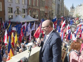The mayor of Gdansk, Pawel Adamowicz,center, addresses a rally he organized in protest against a recent gathering by far-right groups in this Baltic coast city, in Gdansk, Poland, on Saturday, April 21, 2018. A Holocaust survivor slammed Poland's right-wing government for failing to condemn these groups.