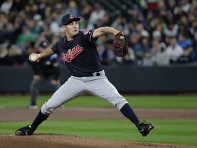 Cleveland Indians starting pitcher Trevor Bauer throws against the Seattle Mariners during the first inning of a baseball game, Sunday, April 1, 2018, in Seattle.