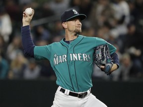 Seattle Mariners starting pitcher Mike Leake throws to an Oakland Athletics batter during the first inning of a baseball game Friday, April 13, 2018, in Seattle.