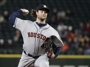 Houston Astros starting pitcher Gerrit Cole throws to a Seattle Mariners batter dyrubg the first inning of a baseball game Wednesday, April 18, 2018, in Seattle.