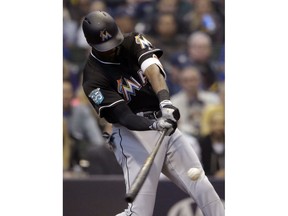 Miami Marlins' Lewis Brinson hits a three-run home run during the second inning of a baseball game against the Milwaukee Brewers, Saturday, April 21, 2018, in Milwaukee.