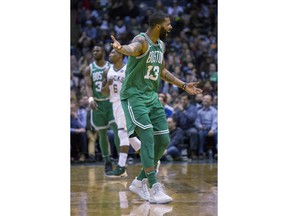 Boston Celtics forward Marcus Morris looks for a foul call after driving to the basket against the Milwaukee Bucks during the second half of an NBA basketball game Tuesday, April 3, 2018, in Milwaukee.