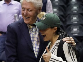 Former President Bill Clinton poses for picture before Game 6 of an NBA basketball first-round playoff series between the Milwaukee Bucks and the Boston Celtics Thursday, April 26, 2018, in Milwaukee.