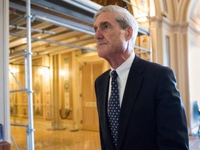 FILE - In this June 21, 2017, file photo, special counsel Robert Mueller departs after a meeting on Capitol Hill in Washington. The Associated Press and other news organizations are asking a judge to unseal records in Mueller's Russia investigation. The media coalition argued in a court filing on April 25, 2018, that Mueller's probe is "one of the most consequential criminal investigations in our nation's history" and that there's overwhelming public interest in records from the case.
