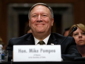 FILE - In this April 12, 2018, file photo Mike Pompeo smiles after his introduction before the Senate Foreign Relations Committee during a confirmation for him to become the next Secretary of State on Capitol Hill in Washington.