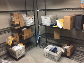 In this April 13, 2018, photo, packages from Internet retailers are delivered with the U.S. Mail in a apartment building mail room in Washington. Clicking "checkout" on an online purchase could cost more after a Supreme Court case being argued April 17.