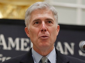 FILE - In this Sept. 28, 2017, file photo Supreme Court Justice Neil Gorsuch speaks in Washington. The Supreme Court said April 17, 2018, that part of a federal law that makes it easier to deport immigrants who have been convicted of crimes is too vague to be enforced. The court's 5-4 decision -- an unusual alignment in which Gorsuch joined the four liberal justices -- concerns a catchall provision of immigration law that defines what makes a crime violent.