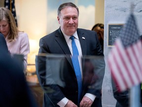 In this April 9, 2018, photo, Secretary of State nominee Mike Pompeo leaves a meeting on Capitol Hill in Washington. Outgoing CIA Director Pompeo will tell senators weighing his confirmation as secretary of state that years of soft U.S. policy toward Russia are "now over." That's according to excerpts of his opening statement obtained by The Associated Press ahead of his Senate hearing on April 12.