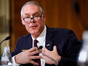 FILE - In this March 13, 2018, file photo, Interior Secretary Ryan Zinke testifies before the Senate Committee on Energy and Natural Resources during a committee hearing on the President's Budget Request for Fiscal Year 2019, in Washington. An internal watchdog says a $12,000 charter flight by Zinke was reviewed and approved by department ethics officials without complete information, because staff who helped schedule the trip did not provide sufficient details. A report by Interior's inspector general says Zinke's use of a chartered flight after he spoke to an NHL team in Las Vegas "might have been avoided" if Interior staff had worked with the team to accommodate Zinke's schedule.