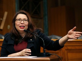 FILE - In this Feb. 14, 2018, photo, Sen. Tammy Duckworth, D-Ill., speaks to Goldman Sachs 10,000 Small Businesses Summit, on Capitol Hill, in Washington. Babies do not care about Senate decorum. But in a bow to working parents, the tradition-bound institution is considering letting the newborns of senators in. The inspiration is Duckworth's daughter, born April 9. Duckworth wants to continue voting, and the Senate requires that votes be cast in person. So she's proposing that babies be allowed into the chamber.