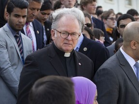 FILE - In this June 13, 2016, file photo Rev. Patrick Conroy, chaplain of the House of Representatives, delivers an interfaith message on the steps of the Capitol in Washington for the victims of the mass shooting at an LGBT nightclub in Orlando.  Conroy, a Roman Catholic priest from the Jesuit order, has been forced out after seven years by House Speaker Paul Ryan after complaints by some lawmakers claimed he was too political.